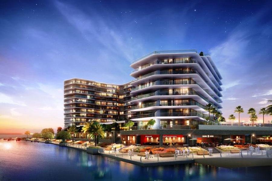 Al Hadeel apartments and townhouses overlooking the azure waters of Al Raha Beach